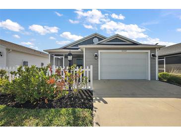 Charming single-Gathering home featuring a two-car garage, screened lanai, and beautiful landscaping at 6248 Siverson Ter, The Villages, FL 32163