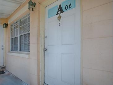 Exterior shot of unit's front door with the unit number and a window at 1400 Eudora Rd # A08, Mount Dora, FL 32757