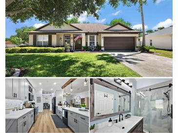 Charming one-story home with a well-manicured lawn, lovely landscaping, and a two-car garage at 1554 Sarus Ave, Groveland, FL 34736