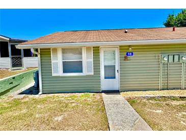 Charming single-story home with a well-maintained lawn and neat landscaping at 10301 Us Highway 27 # 98, Clermont, FL 34711