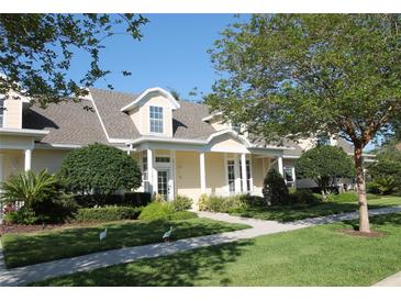 Charming single-Gathering home with well-manicured lawn, inviting walkway, and beautiful landscaping at 292 Nautica Mile Dr, Clermont, FL 34711
