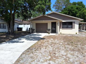 Charming single-story home featuring a garage and well-maintained landscaping at 37 N Normandale Ave, Orlando, FL 32835