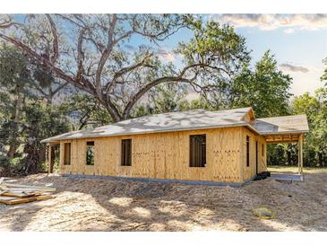 Exterior view of a home under construction with wooden framing and a partially completed roof at Lot 3 Indian Estates Cr 423, Lake Panasoffkee, FL 33538