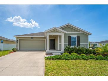 Charming one-story home with a well-maintained lawn and inviting front porch at 5354 Travertine St, Mount Dora, FL 32757