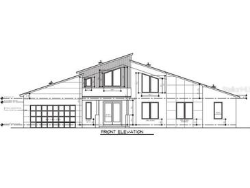 Front exterior elevation featuring a two-story home with a modern design and a two-car garage at 30551 Saffron Ave, Eustis, FL 32736