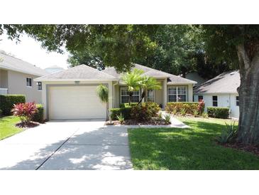 Charming single-story home featuring a well-maintained lawn and attractive landscaping at 2131 Burley Ave, Clermont, FL 34711