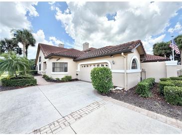 Charming single-Gathering home with a tile roof, well-maintained landscaping, and a spacious driveway at 26612 Bella Vista Dr, Howey In The Hills, FL 34737