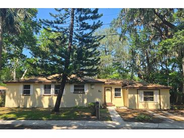 Charming single-story home with a well-maintained front yard and mature trees at 365 Fletcher Ave, Daytona Beach, FL 32114