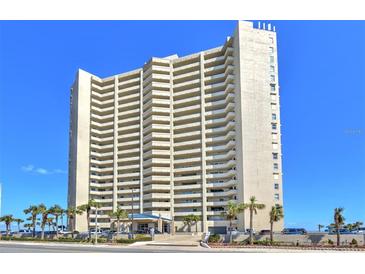 Beautiful exterior of high-rise condo building with multiple balconies and blue skies at 3425 S Atlantic Ave # 1101, Daytona Beach, FL 32118