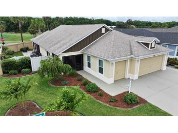 Home with a three car garage and well maintained landscaping at 3466 Smedley Rd, The Villages, FL 32163