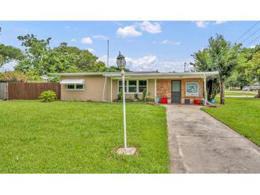 Charming single-story home with a well-maintained lawn and inviting front porch at 1 W Pierce Ave, Orlando, FL 32809