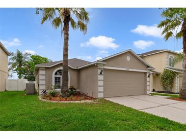 Charming single-Gathering home with well-manicured lawn and mature palm trees at 15169 Harrowgate Way, Winter Garden, FL 34787