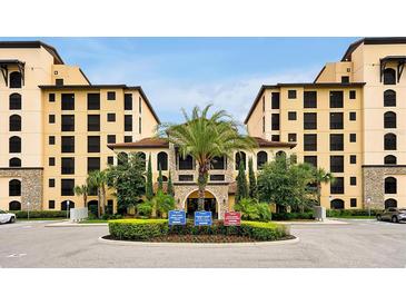 Beautiful resort-style exterior view of building featuring manicured landscaping and palm trees at 16300 County Road 455 # 202, Montverde, FL 34756