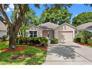 Charming single-story home with well-maintained landscaping, mature trees, and a cozy, inviting curb appeal at 3586 Eversholt St, Clermont, FL 34711