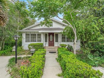 Charming home with well maintained lawn, lovely landscaping, and inviting front entrance at 504 Gilliam St, Wildwood, FL 34785