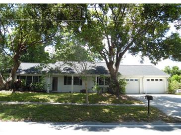 Charming single-story home with a well-maintained lawn and mature trees in a quiet neighborhood setting at 40 N Triplet Lake Dr, Casselberry, FL 32707