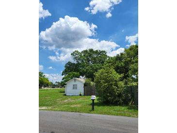 Cozy home featuring a mailbox with a clear view of the structure and lush surrounding landscape at 2611 Hiawatha Ave, Sanford, FL 32773