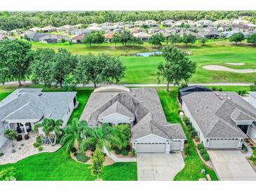 Gorgeous home situated on lush green golf course with scenic views and mature trees at 3681 Arlington Ridge Blvd, Leesburg, FL 34748