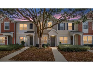 Three-unit townhome building with appealing landscaping and evening lighting at 4904 Sw 45Th St, Ocala, FL 34474