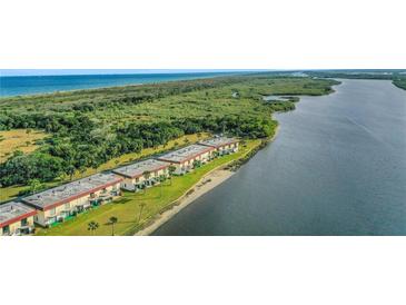 Aerial view of waterfront condos with ocean access at 14 Ocean Palm Villa S # 14, Flagler Beach, FL 32136