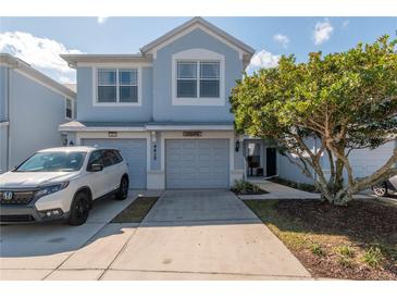 Charming two-story townhouse with a well-manicured lawn and driveway, providing an inviting curb appeal at 4410 Sw 52Nd Cir # 108, Ocala, FL 34474