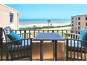 Relaxing balcony offers stunning ocean views with seating, perfect for enjoying the coastal scenery at 3370 Ocean Shore Blvd # 5020, Ormond Beach, FL 32176