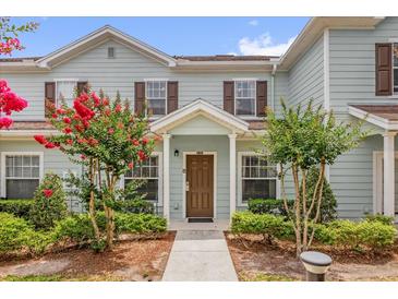 Charming townhome with a well-maintained lawn and a walkway leading to the front door at 2950 Lucayan Harbour Cir # 107, Kissimmee, FL 34746