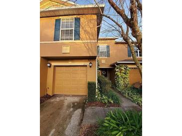 Charming townhome featuring a well-maintained front exterior and an attached single-car garage at 3875 Shaftbury Pl, Oviedo, FL 32765
