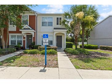 Charming townhome featuring well-maintained landscaping and convenient accessible parking space at 4426 Sw 49Th Ave, Ocala, FL 34474