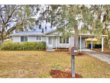 Cute ranch home with carport and mature landscaping at 337 Swingle St, Frostproof, FL 33843