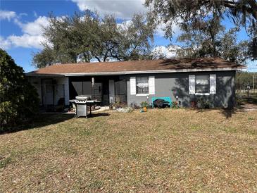 Ranch-style home with fenced yard and mature trees at 4718 Cynthia St, Bartow, FL 33830