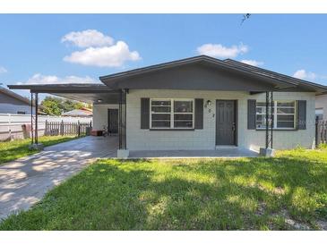 Charming single-story home with a covered carport and a well-maintained lawn at 602 Taylor Blvd, Winter Haven, FL 33880