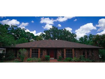 Charming brick home with a new roof and manicured landscaping at 4428 Sugartree E Dr, Lakeland, FL 33813