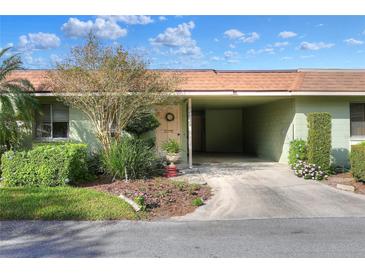 Charming single-story home featuring a covered carport, well-maintained landscaping, and a welcoming front entrance at 2203 Starboard Rd, Winter Haven, FL 33881