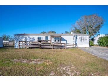 Single-wide manufactured home with ramp access at 4307 Meadow Ridge Ct, Mulberry, FL 33860