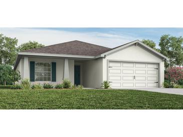 One-story home with a two-car garage and landscaped lawn at 555 Silver Course Run, Ocala, FL 34472