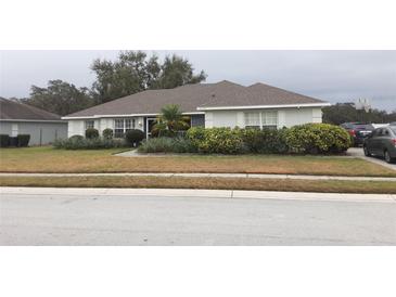 Single-story home with a well-maintained lawn and driveway at 6759 Ashbury Dr, Lakeland, FL 33809