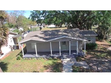 Inviting single-story home with a covered front porch and well-maintained lawn at 3016 Hutchins St, Eaton Park, FL 33840