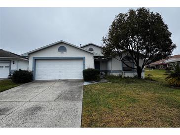 Single story home with attached garage and mature landscaping at 2290 Silver Re Dr, Lakeland, FL 33810