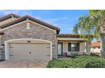 Inviting exterior with stone accents and a two-car garage at 4003 Solamor St, Lakeland, FL 33810