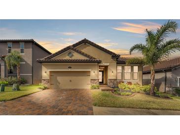 Beautiful craftsman style home with a 2 car garage and lush landscaping at 4224 Prima Lago Dr, Lakeland, FL 33810