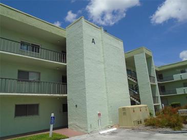 Light green building with a staircase and access for disabled at 1130 N Lake Parker Ave # A202, Lakeland, FL 33805