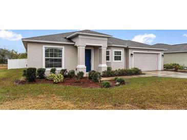 One-story home with a two-car garage and landscaped front yard at 155 Kissengen Park Blvd, Bartow, FL 33830