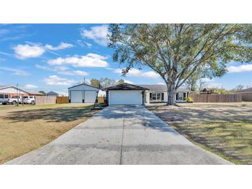 Cute ranch home with detached garage and large backyard at 5125 Pheasant Dr, Mulberry, FL 33860