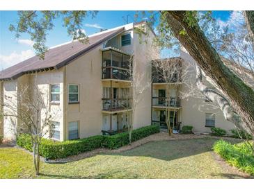 Beautiful multi-story condo with balconies and manicured landscaping at 2025 Sylvester Rd # N304, Lakeland, FL 33803