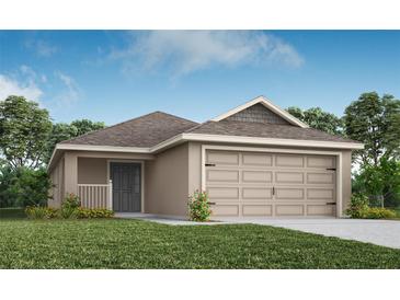 One-story house with beige exterior, gray door, and two-car garage at 5536 Maddie Dr, Haines City, FL 33844