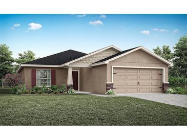 One-story home with tan siding, dark roof, and a two-car garage at 7602 Sw 107Th Ln, Ocala, FL 34480