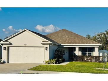 Charming single-story home with well-maintained lawn and neutral-toned exterior at 4540 Penkert Pl, Lakeland, FL 33811