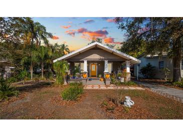 Charming single-story home with a welcoming front porch and professionally landscaped front yard at 531 Hunter St, Lakeland, FL 33803