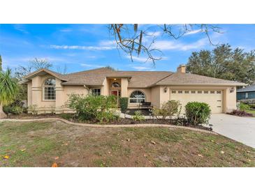 Charming single-story home boasts a well-manicured lawn and inviting curb appeal at 6244 Napa Dr, Lakeland, FL 33813